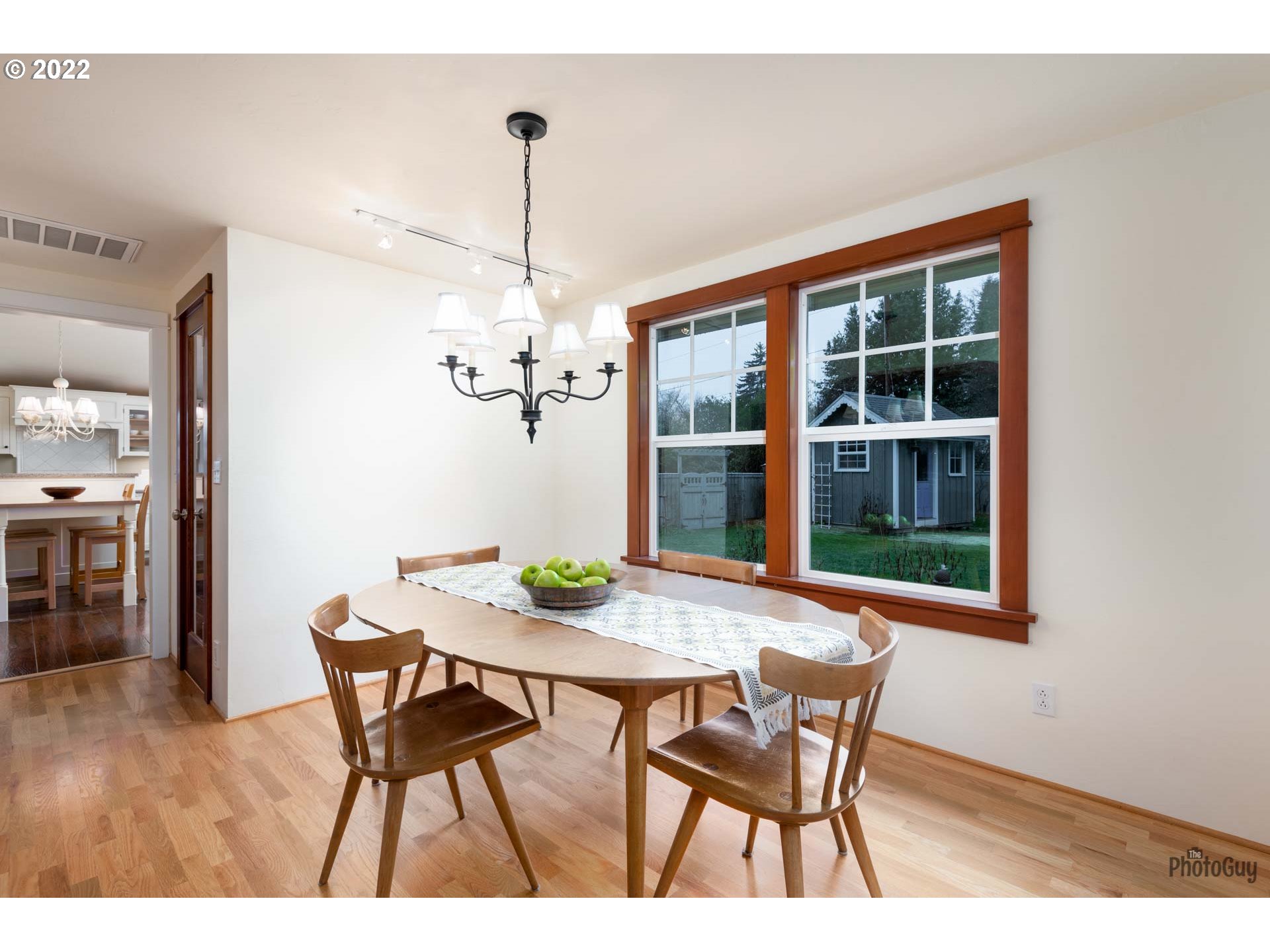 2027 Monterey Lane Eugene, OR 97401 - Photo 7 of 32 a view of a dining room with furniture window and wooden floor