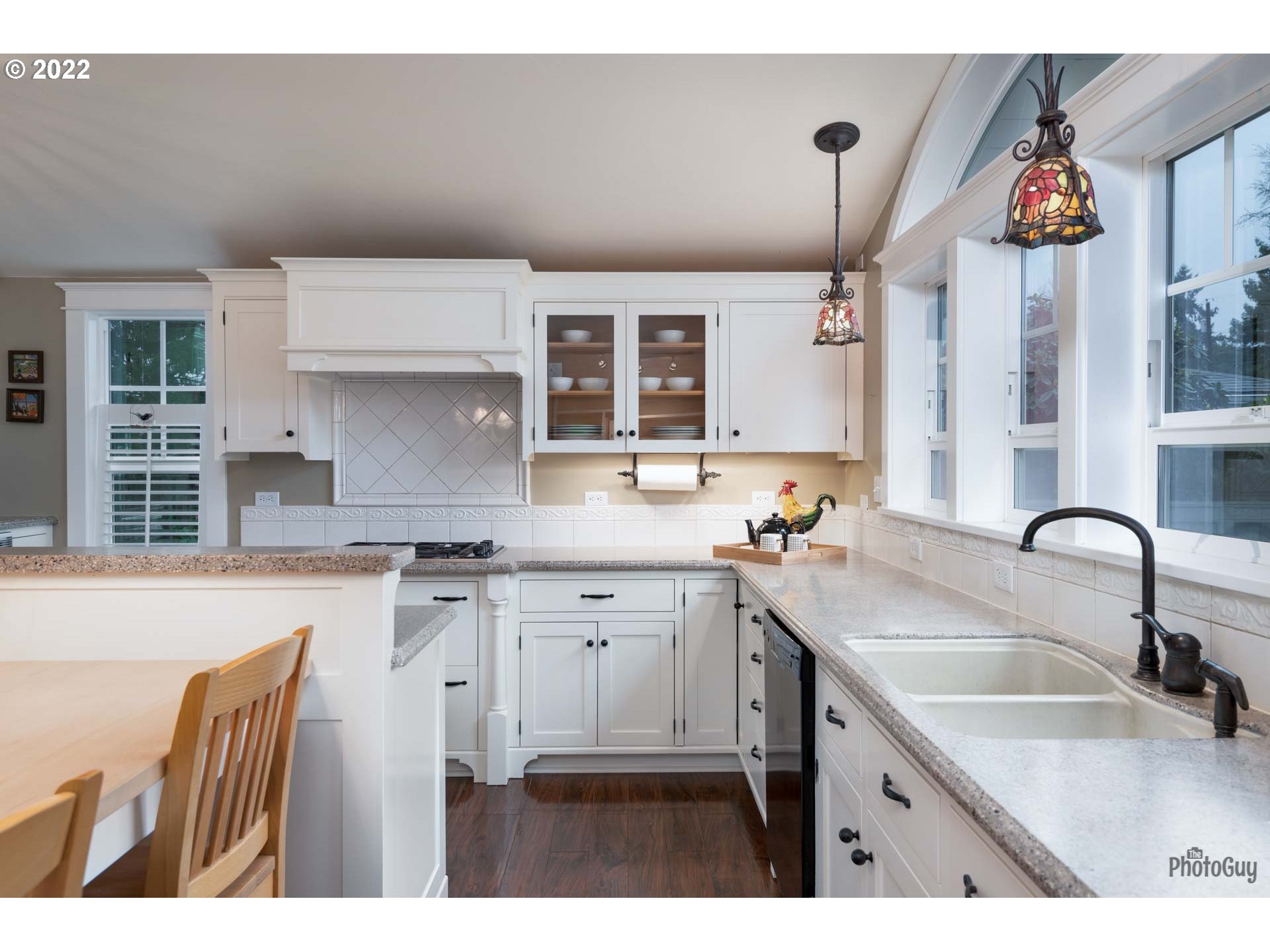 2027 Monterey Lane Eugene, OR 97401 - Photo 9 of 32 a kitchen with granite countertop a sink a counter and cabinets