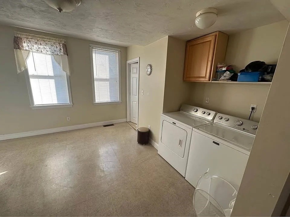 150 Sumner Street, Unit 1 Quincy, MA 02169 - Photo 4 of 10 a view of workspace with wooden floor washer and dryer