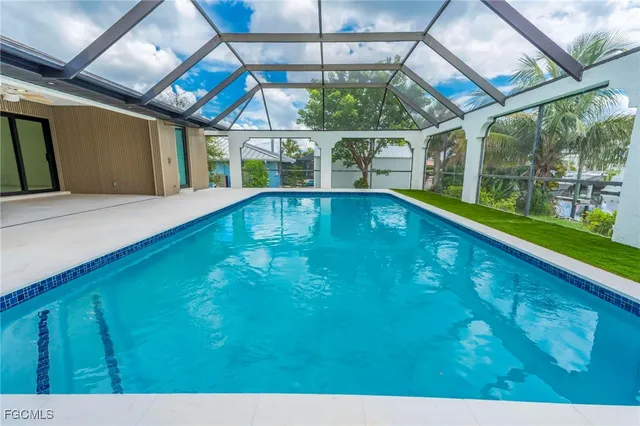a view of swimming pool with a patio