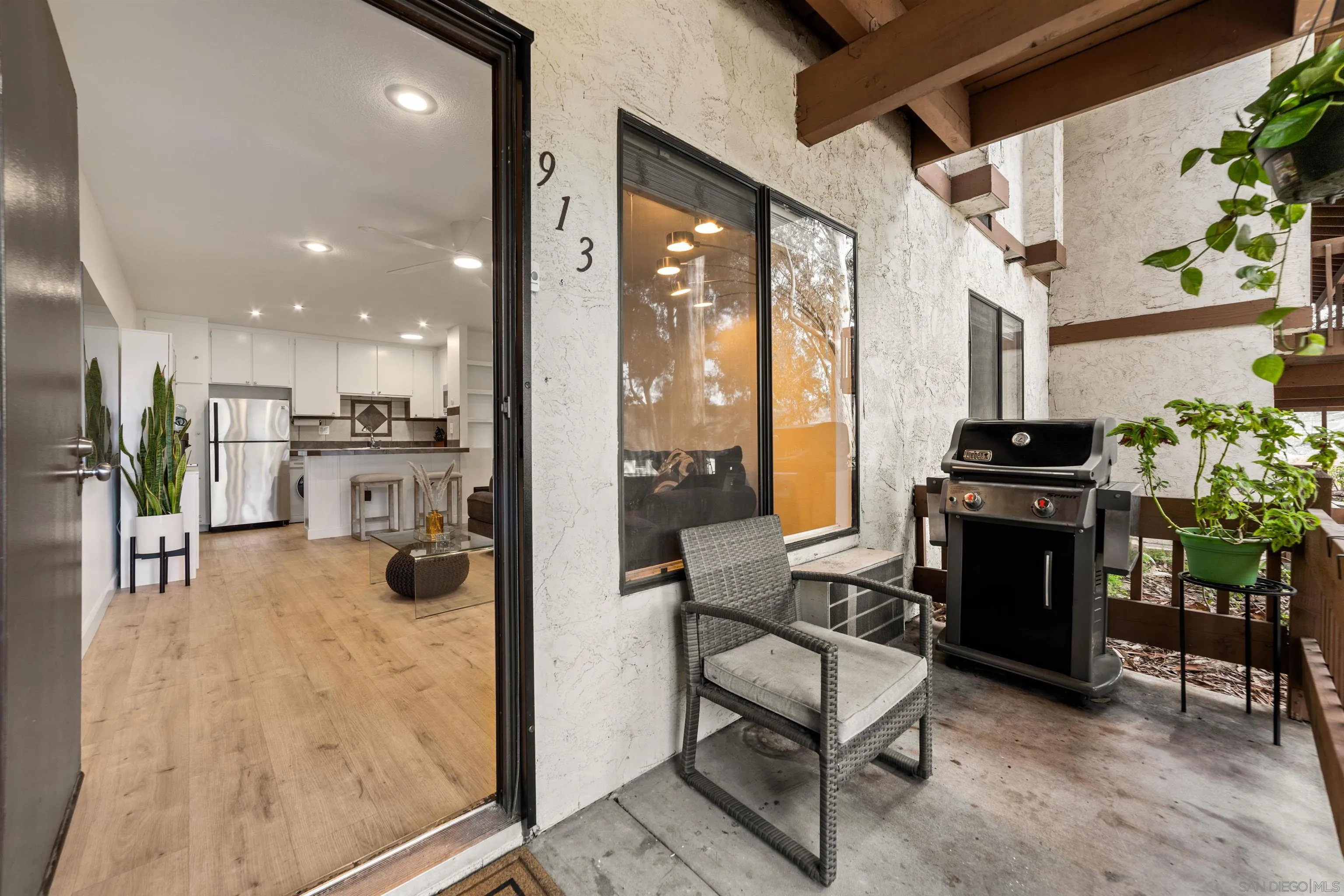 6370 Rancho Mission Road, Unit 913 San Diego, CA 92108 - Photo 1 of 30 a kitchen with stainless steel appliances kitchen island granite countertop a refrigerator and a stove top oven
