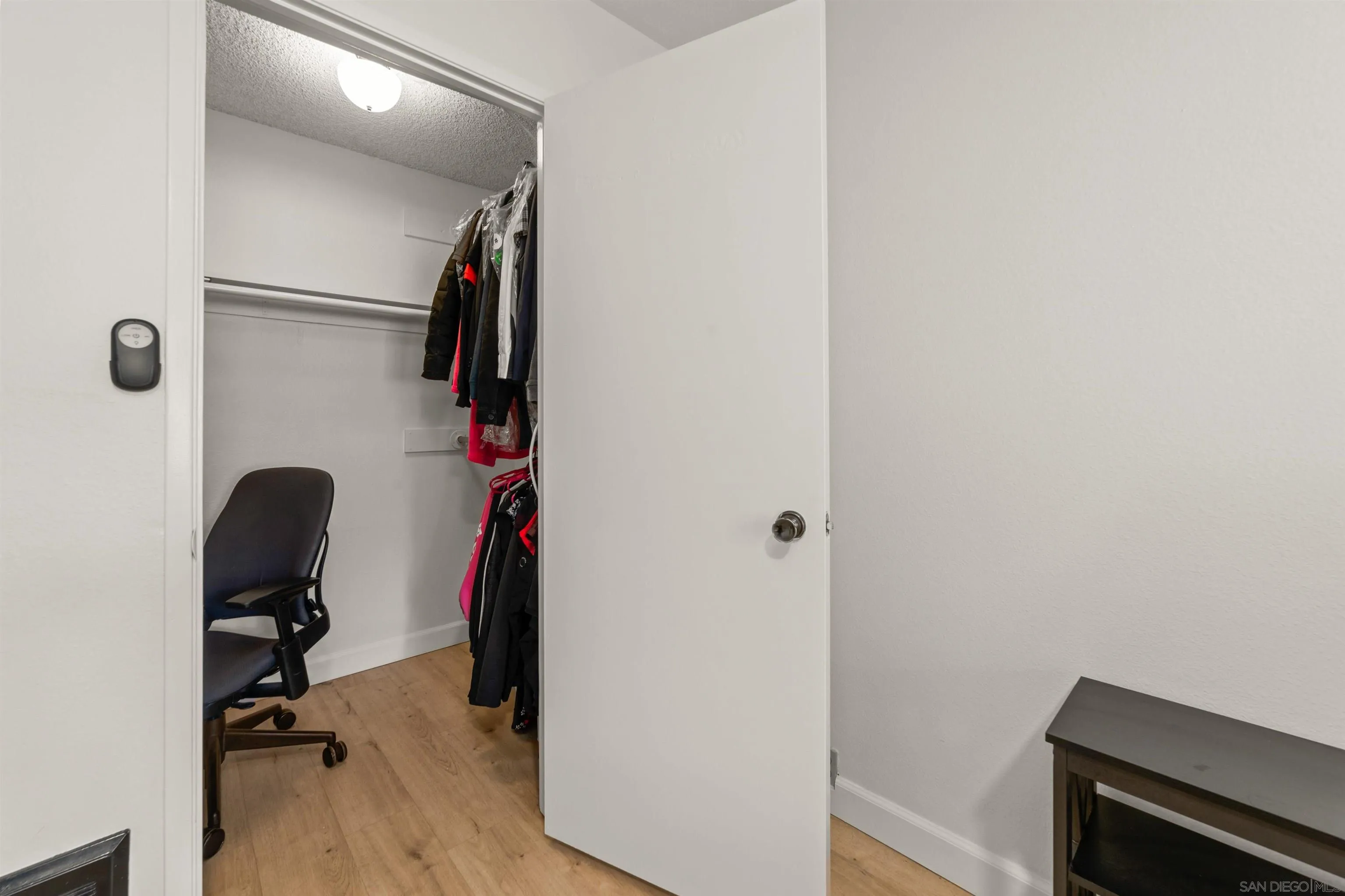 6370 Rancho Mission Road, Unit 913 San Diego, CA 92108 - Photo 12 of 30 a view of walk in closet with clothes and shoes