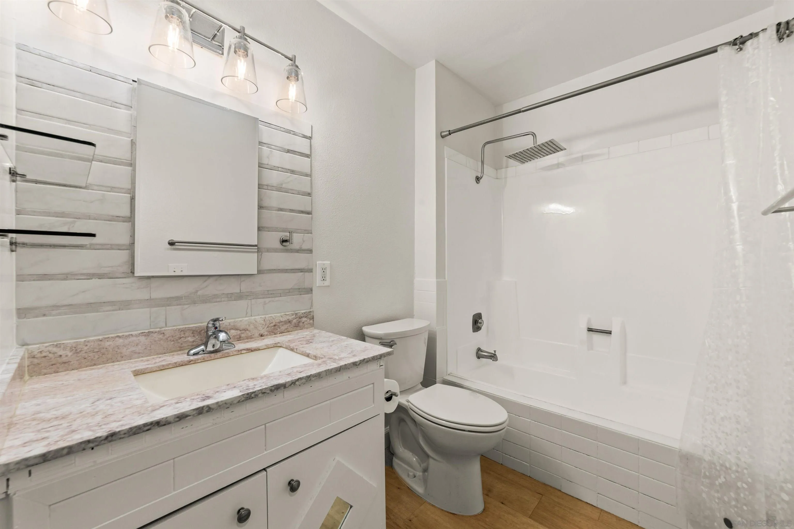 6370 Rancho Mission Road, Unit 913 San Diego, CA 92108 - Photo 15 of 30 a bathroom with a granite countertop sink a toilet and shower