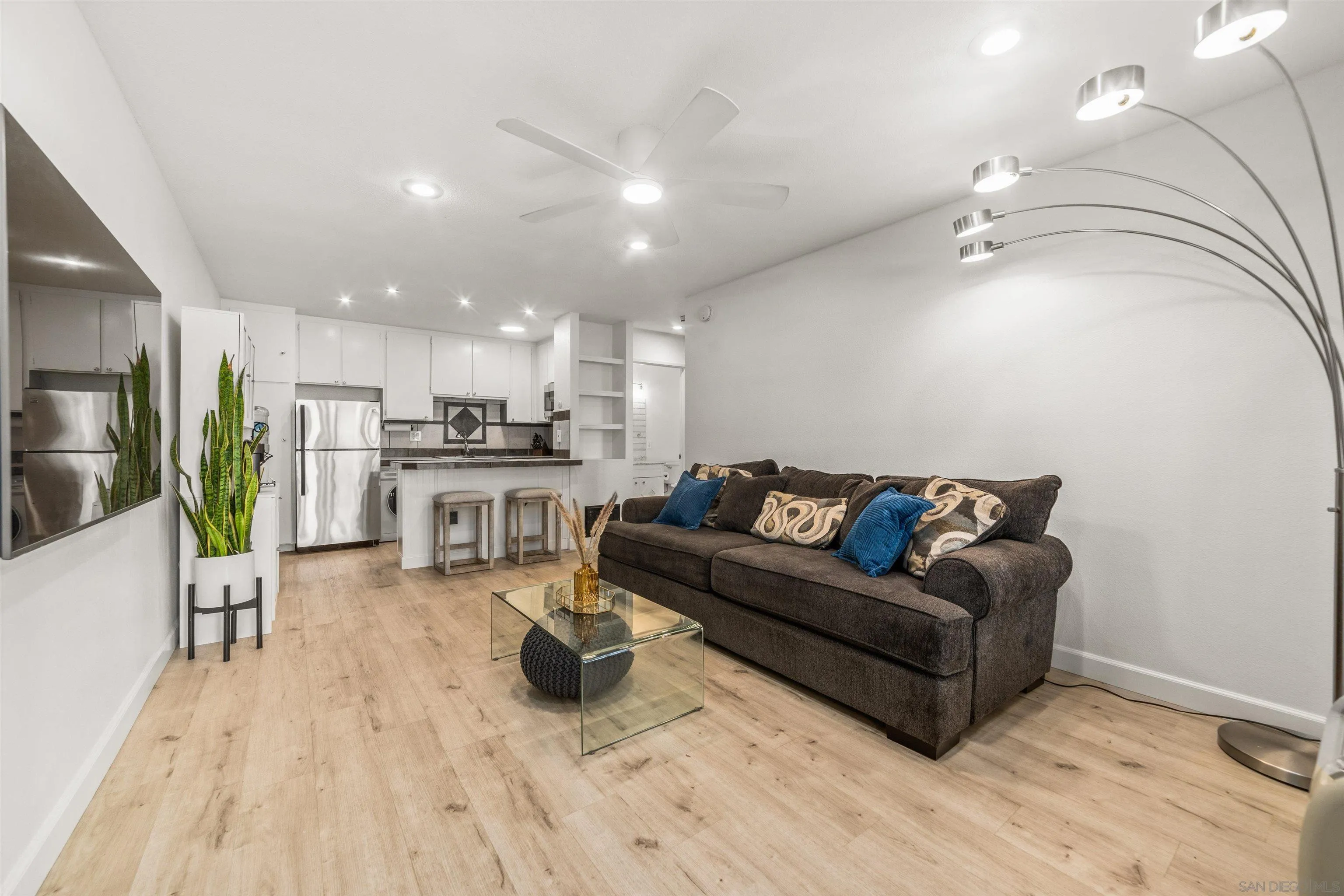 6370 Rancho Mission Road, Unit 913 San Diego, CA 92108 - Photo 2 of 30 a living room with furniture and kitchen view