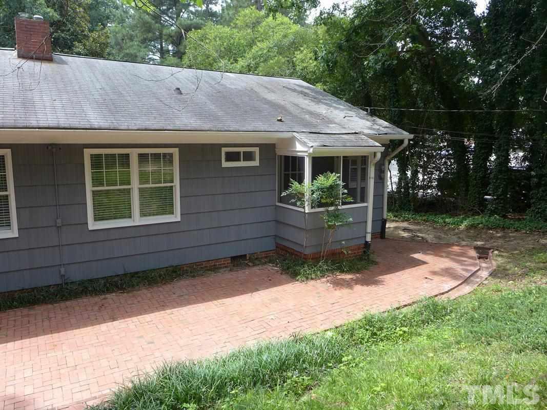 731 Raleigh Road Chapel Hill, NC 27514 - Photo 12 of 14 a view of a house with a yard and a garden