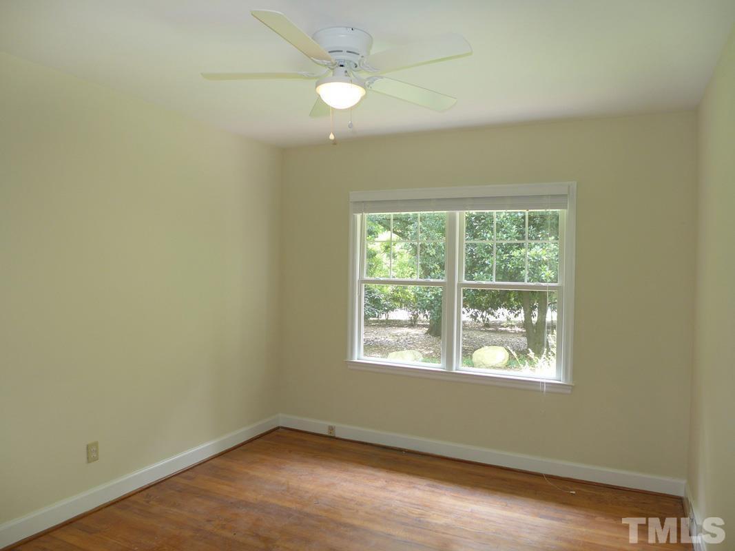 731 Raleigh Road Chapel Hill, NC 27514 - Photo 8 of 14 an empty room with a window