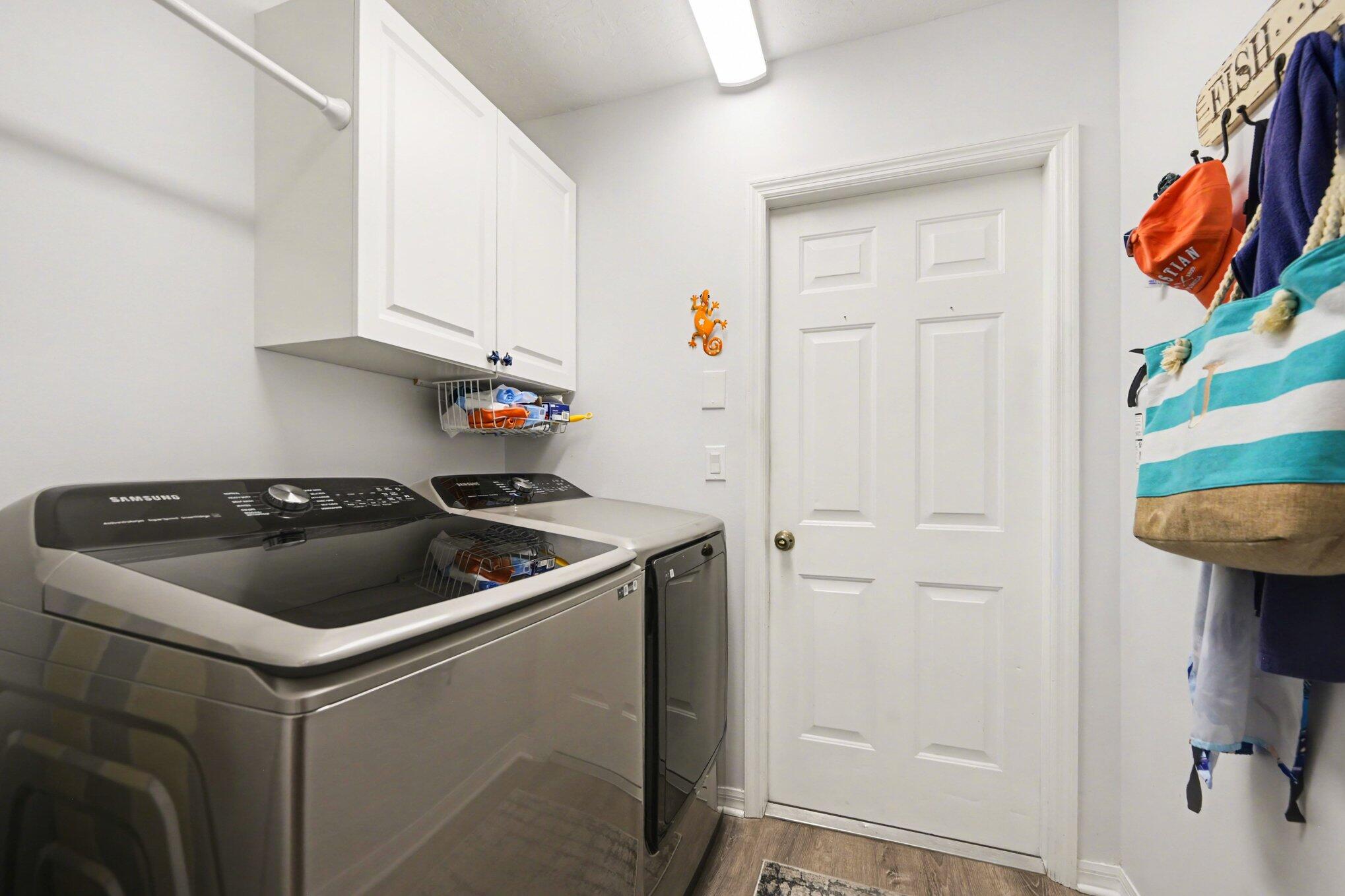 1362 Seahouse Street Sebastian, FL 32958 - Photo 22 of 28 a kitchen with white cabinets and sink