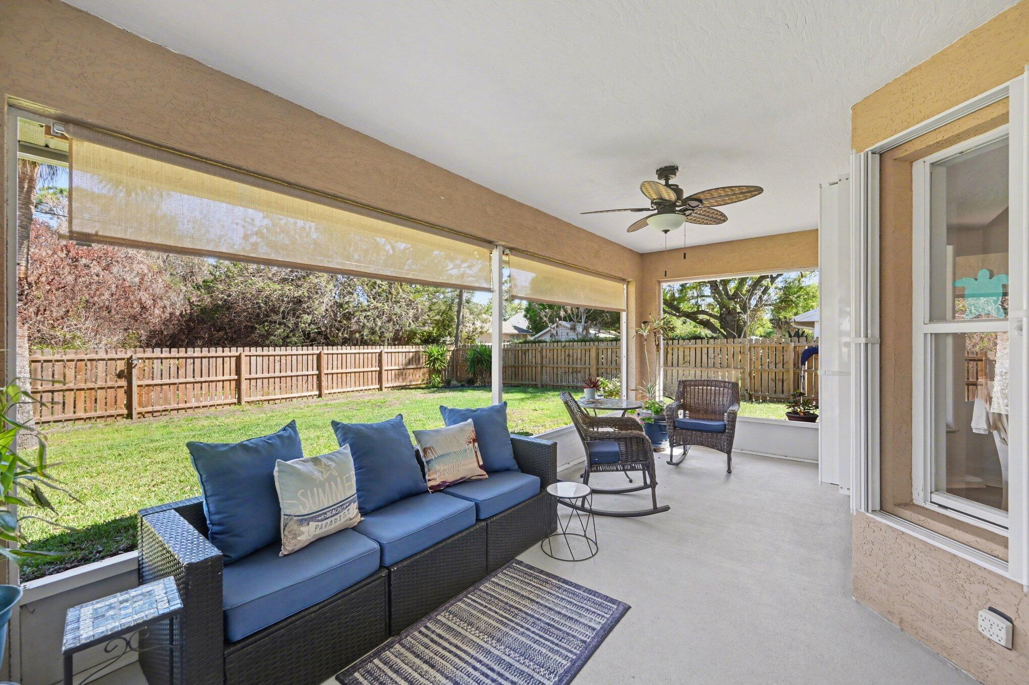 1362 Seahouse Street Sebastian, FL 32958 - Photo 23 of 28 a balcony with furniture and a garden