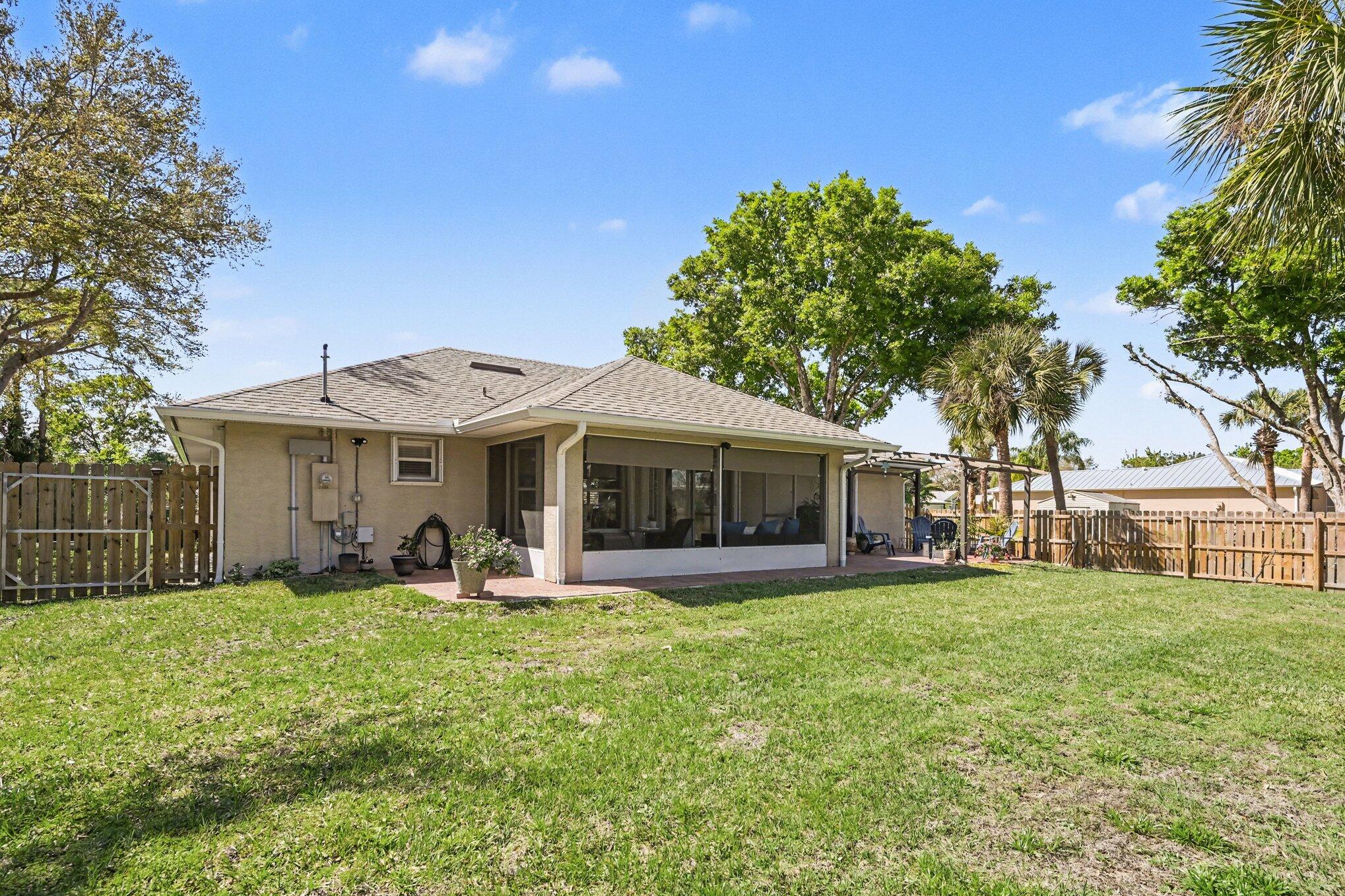 1362 Seahouse Street Sebastian, FL 32958 - Photo 27 of 28 a front view of a house with patio and garden