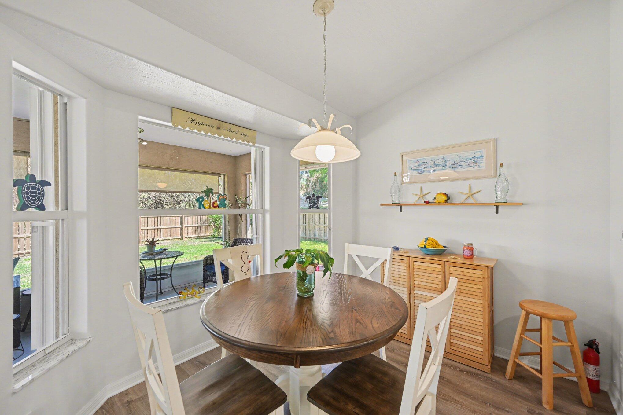 1362 Seahouse Street Sebastian, FL 32958 - Photo 9 of 28 a dining room with furniture and window
