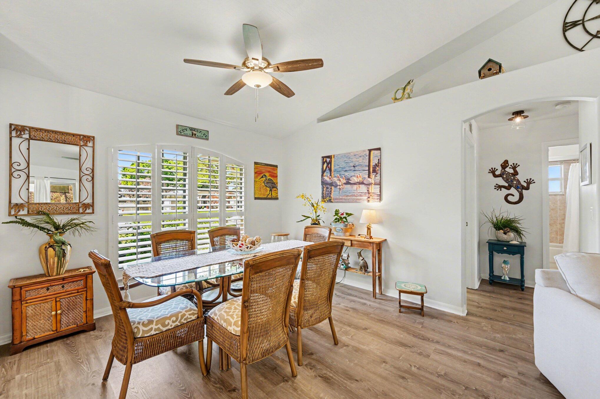 1362 Seahouse Street Sebastian, FL 32958 - Photo 10 of 28 a view of a dining room with furniture window and wooden floor