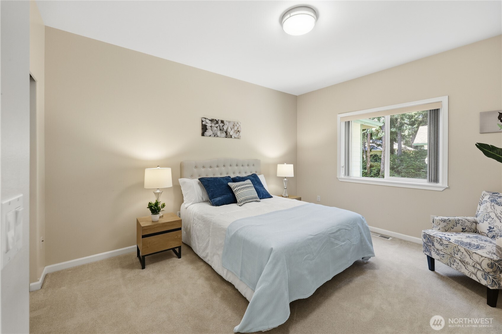 4354 Northwest Westgate Road Silverdale, WA 98383 - Photo 17 of 40 a bedroom with a bed and a window