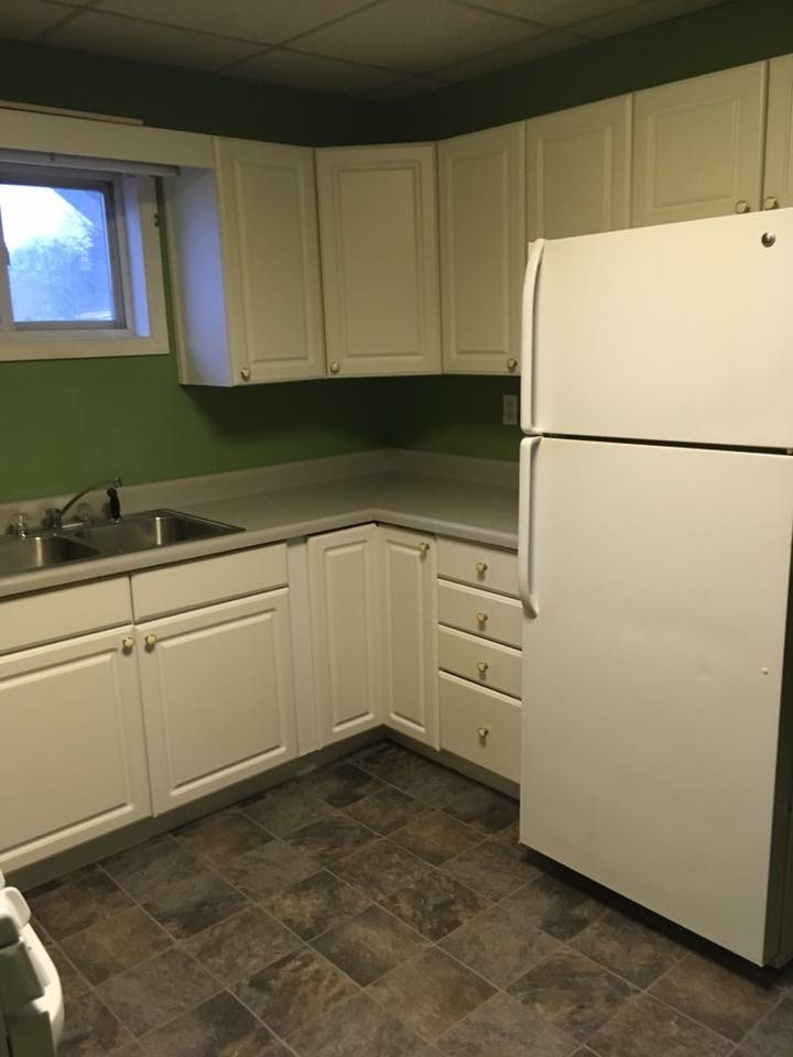 504 State Street Ottawa, IL 61350 - Photo 2 of 19 a kitchen with cabinets and white appliances