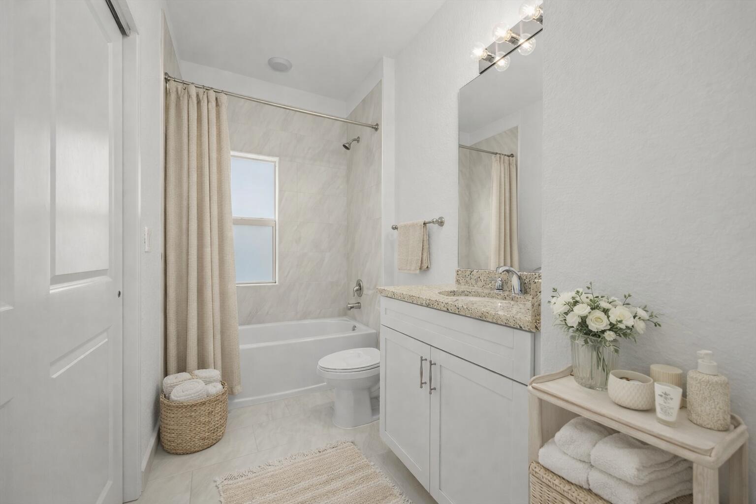 2575 Southeast Bonita Street Stuart, FL 34997 - Photo 13 of 17 a bathroom with a granite countertop toilet a sink and a mirror