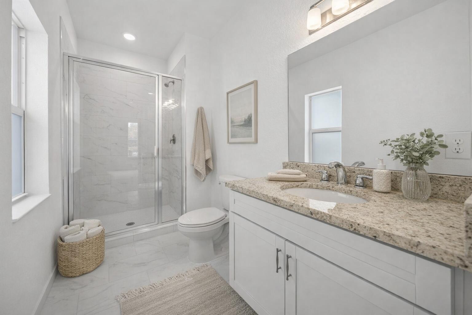 2575 Southeast Bonita Street Stuart, FL 34997 - Photo 14 of 17 a bathroom with a granite countertop sink a toilet and shower