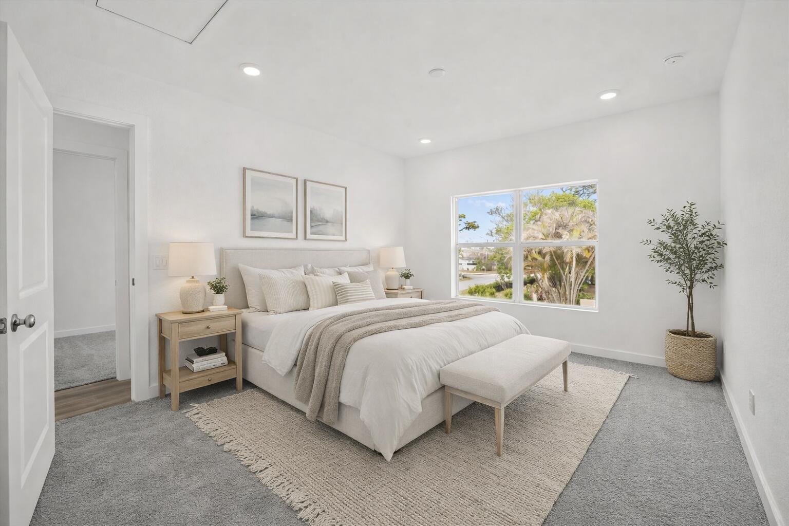 2575 Southeast Bonita Street Stuart, FL 34997 - Photo 15 of 17 a spacious bedroom with a bed and a painting on the wall