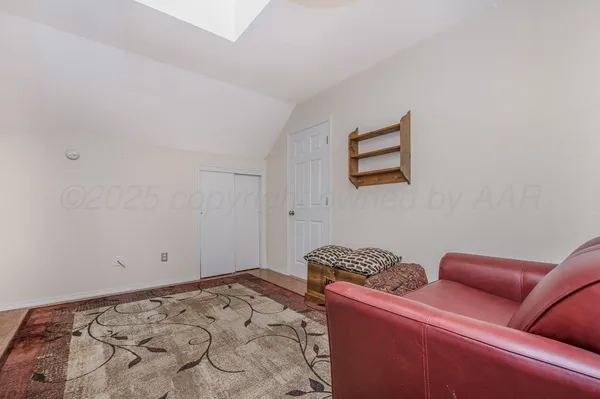 a bedroom with bed and a window