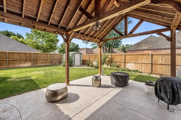 a view of a patio with couches and pool