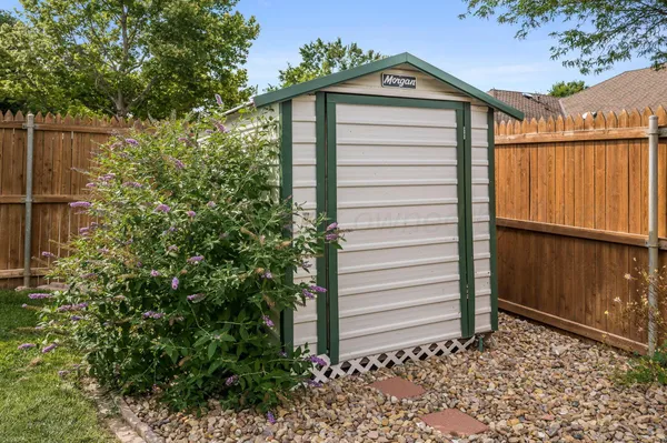 a view of a house with a small yard