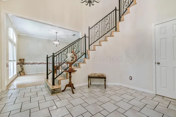 a view of entryway with wooden floor and next to a window