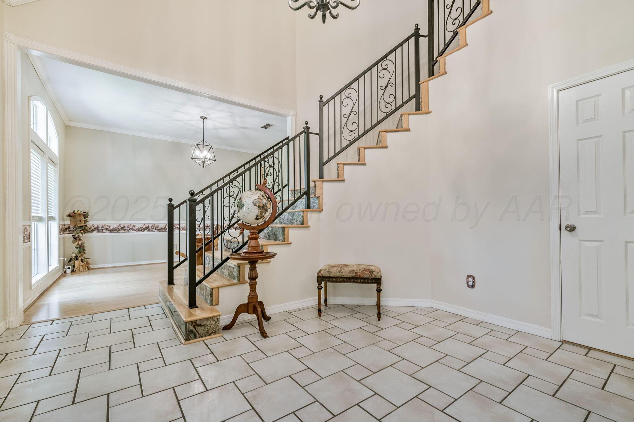 7809 Bent Tree Drive Amarillo, TX 79121 - Photo 3 of 32 a view of entryway with wooden floor and next to a window