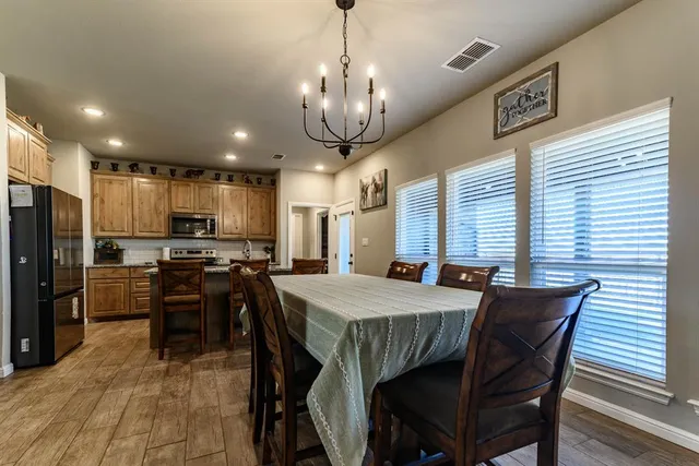 a view of a dining room with furniture