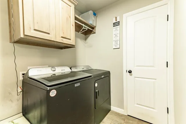 a living room with furniture and a dresser