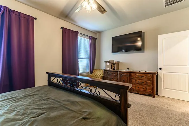 a bathroom with a double vanity sink mirror and shower