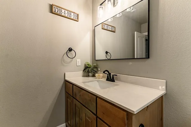 a white toilet sitting next to a bath tub