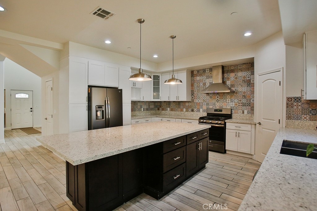 592 South Devon Road Orange, CA 92868 - Photo 1 of 1 Entertainers kitchen with large island and counter seating