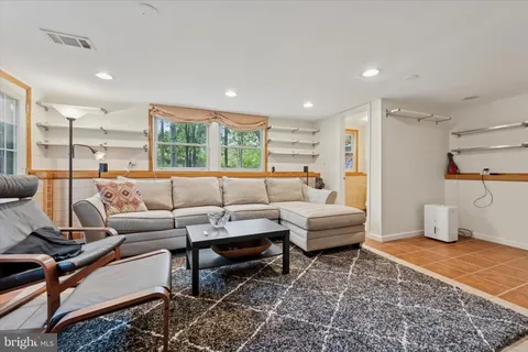 a living room with furniture and a rug