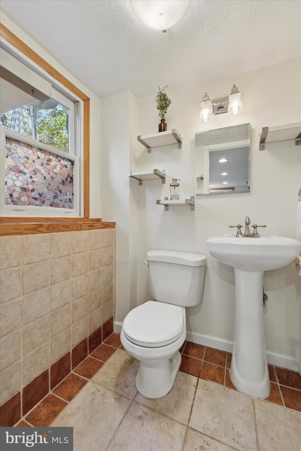 808 Berwyn Baptist Road Devon, PA 19333 - Photo 12 of 26 a bathroom with a sink mirror and toilet