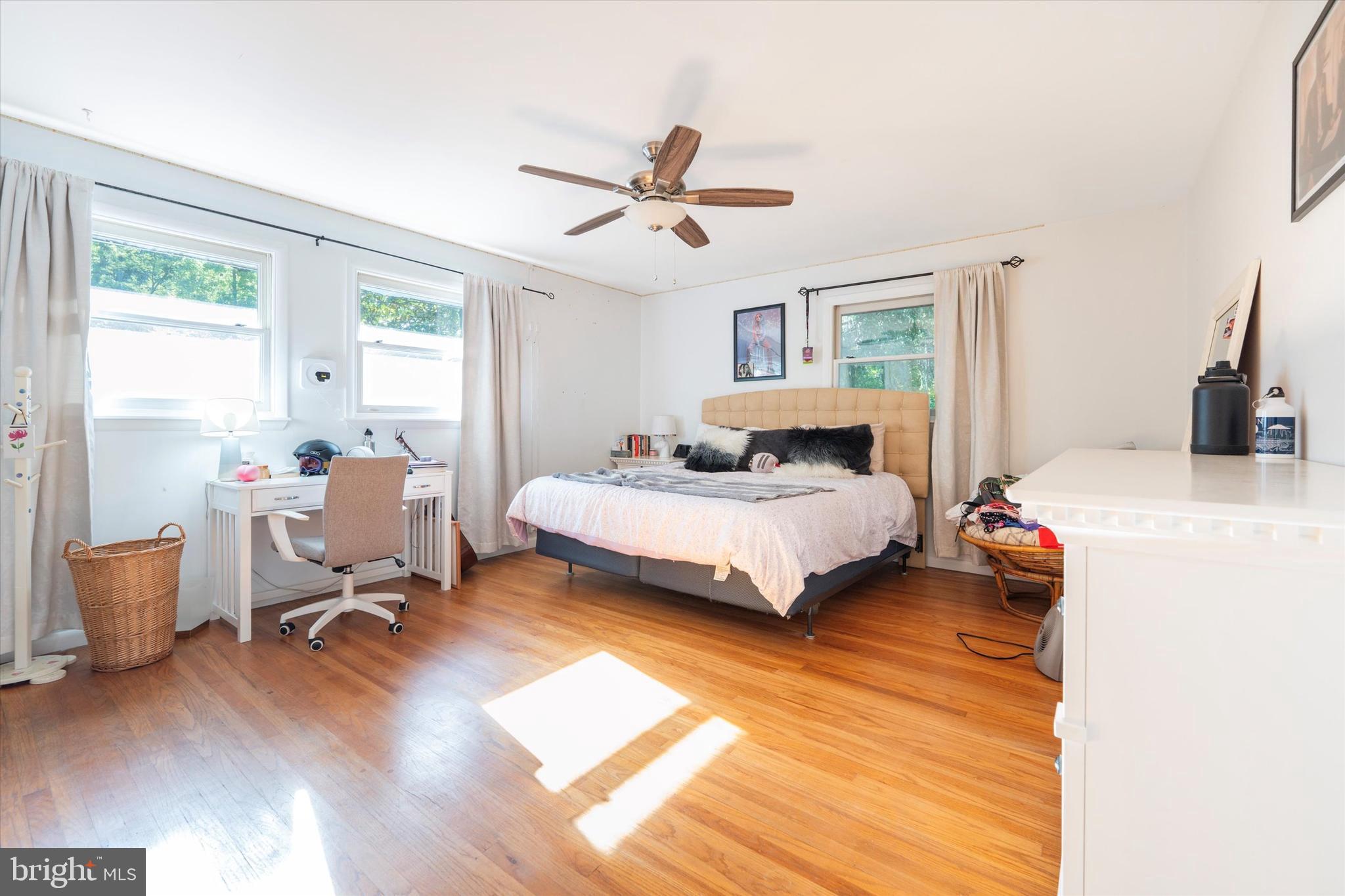 808 Berwyn Baptist Road Devon, PA 19333 - Photo 21 of 26 a bedroom with a bed and wooden floor