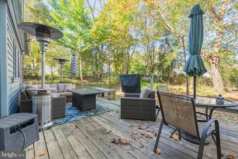 a view of a chairs and table in the patio