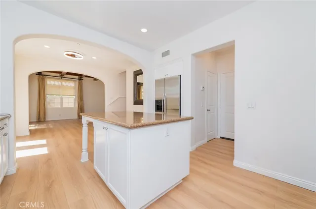 a view of a hallway view with wooden floor and staircase