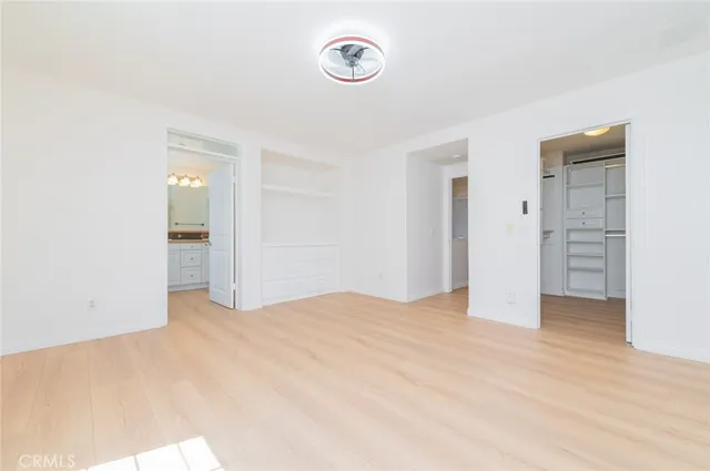 a bathroom with a sink double vanity granite and a mirror