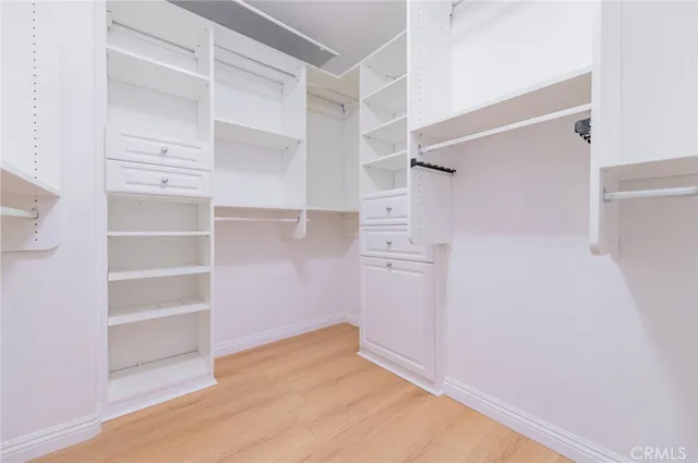 a couple of potted plants in front of a brick building