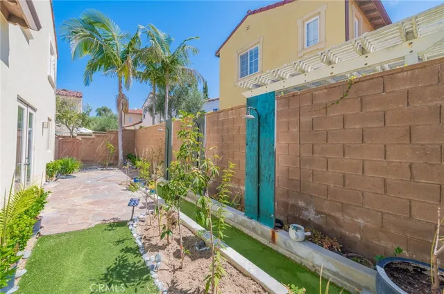 a couple of flower plants in front of door