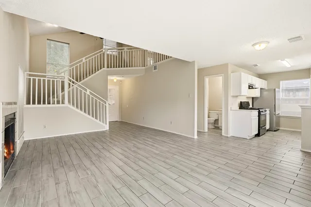 a view of kitchen with furniture and wooden floor
