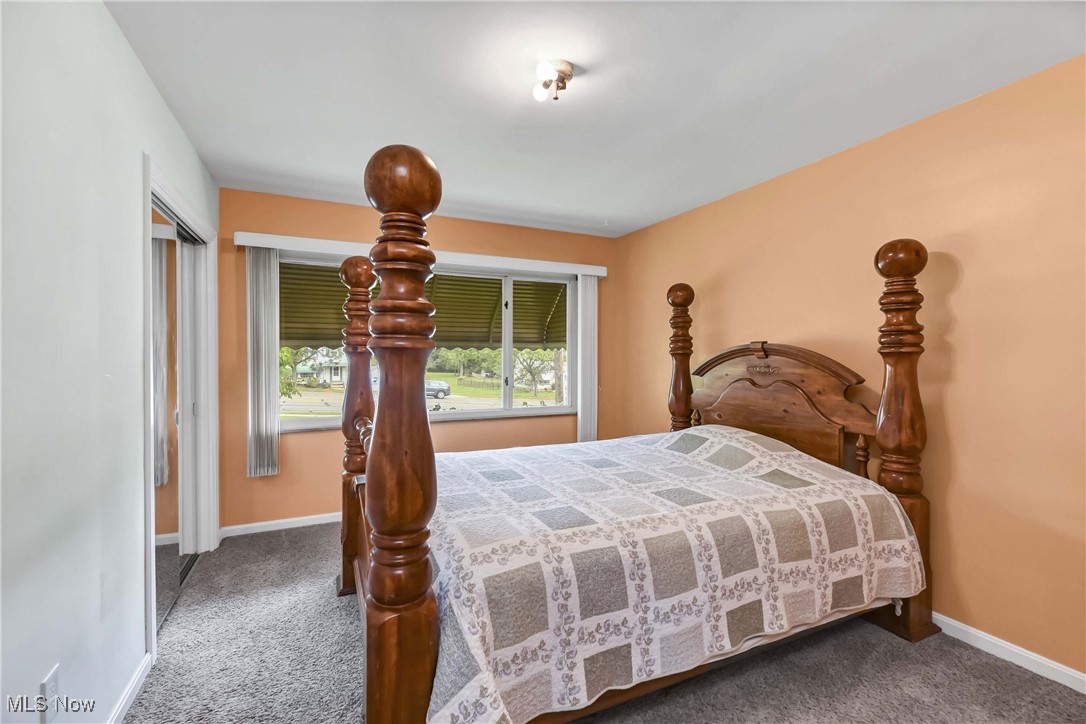 4908 East Pleasant Valley Road Independence, OH 44131 - Photo 11 of 31 Guest bedroom with carpet (hardwood underneath) and overhead light