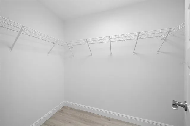 a view of a room with racks on the wall