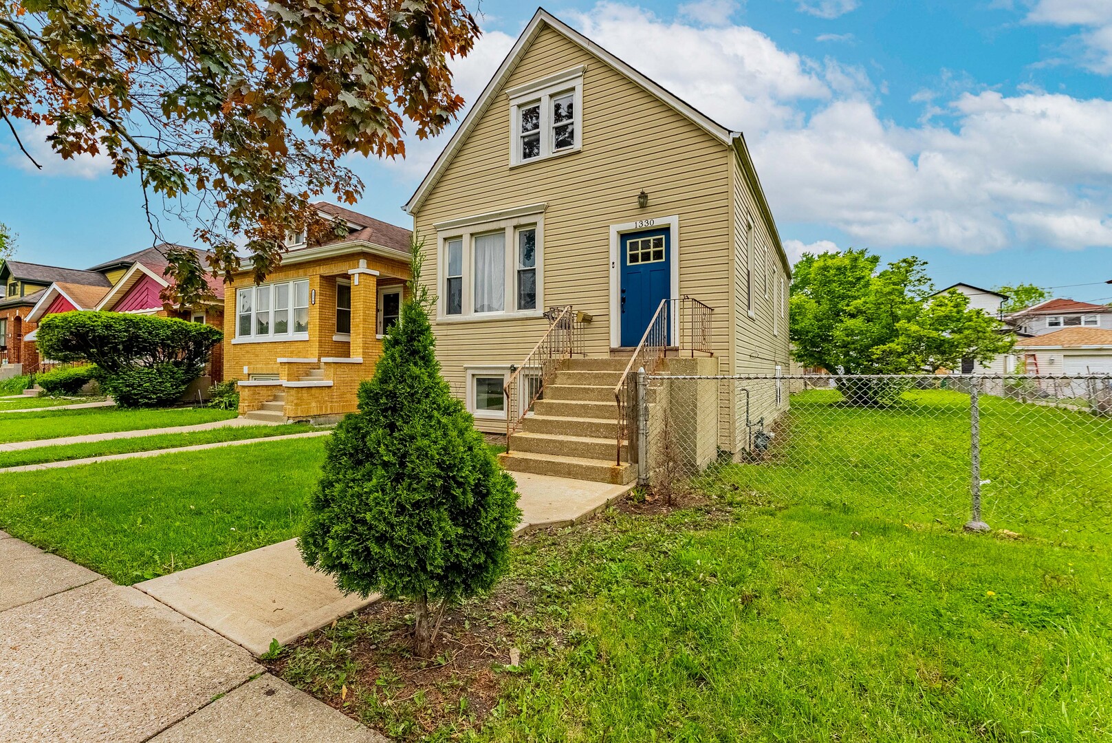 a front view of a house with a yard