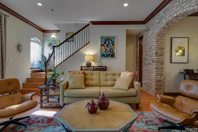 a living room with furniture and a rug