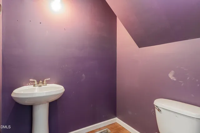 a bathroom with a sink toilet