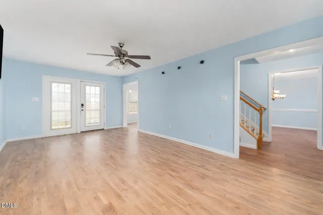 a kitchen with granite countertop a stove a sink and a microwave