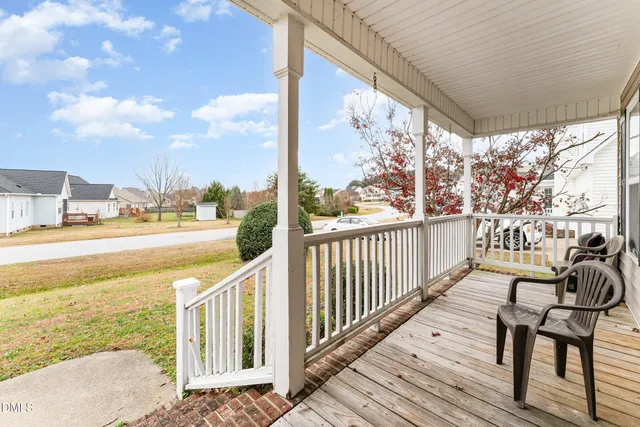 a view of a balcony with lake view and wooden floor
