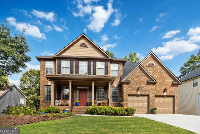 a front view of a house with garden