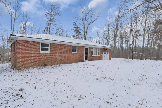 a backyard of a house with large trees