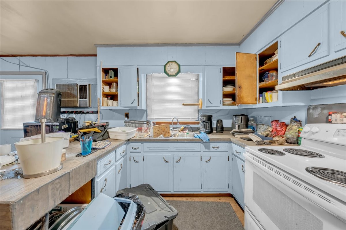 646 Main Street Altamont, TN 37301 - Photo 13 of 39 a kitchen with a sink stove and cabinets