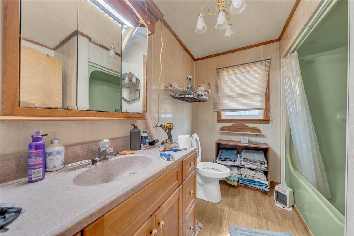 646 Main Street Altamont, TN 37301 - Photo 17 of 39 a bathroom with a sink a toilet and a mirror